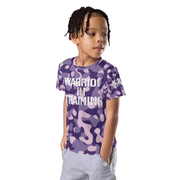 A young boy in a 'Warrior in Training' Kids Crew Neck T-Shirt (Purple Camo) undergoes warrior training.