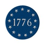 A blue and white 1776 flag patch with the number 1776 on it, representing patriotic significance.