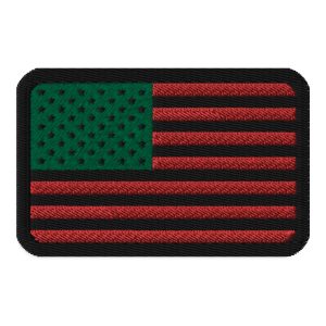 An inspired David Hammons Inspired Flag Patch, featuring an American flag embroidered on a black patch.