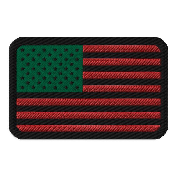An inspired David Hammons Inspired Flag Patch, featuring an American flag embroidered on a black patch.
