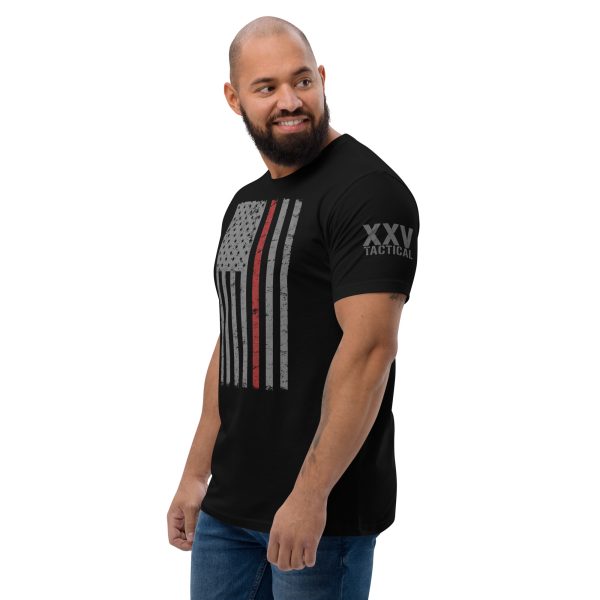 A man wearing a black t-shirt with the American flag and the Thin Red Line Flag on it.