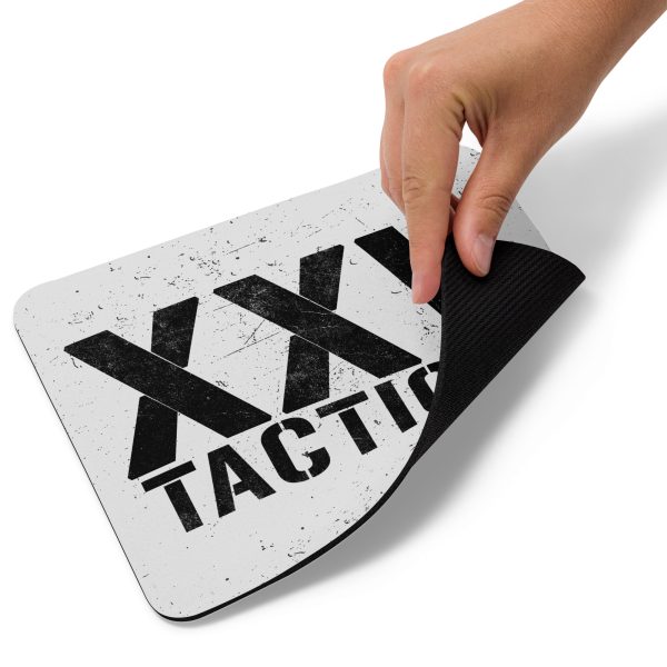 A person holding the XXV Tactical Mouse Pad.