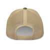 The back of a tan XXV Tactical Trucker Cap on a black background.