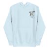 A light blue Woman's Stay Salty Embroidered Hoodie with an image of a fish on it.