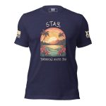 A Stay; Tomorrow Needs You T-Shirt featuring an image of a palm tree silhouetted against a beautiful sunset.