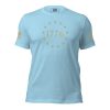 A men's light blue t-shirt with gold stars and a Men's 1776 Betsy Ross Flag T-Shirt.