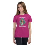 A Youth Love, Waves & Mermaids T-Shirt wearing a pink mermaid t-shirt as she happily rides the ocean waves, proudly displaying her love for mermaids.