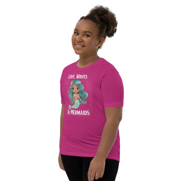A youth girl wearing a Youth Love, Waves & Mermaids T-Shirt expressing her love for mermaids.